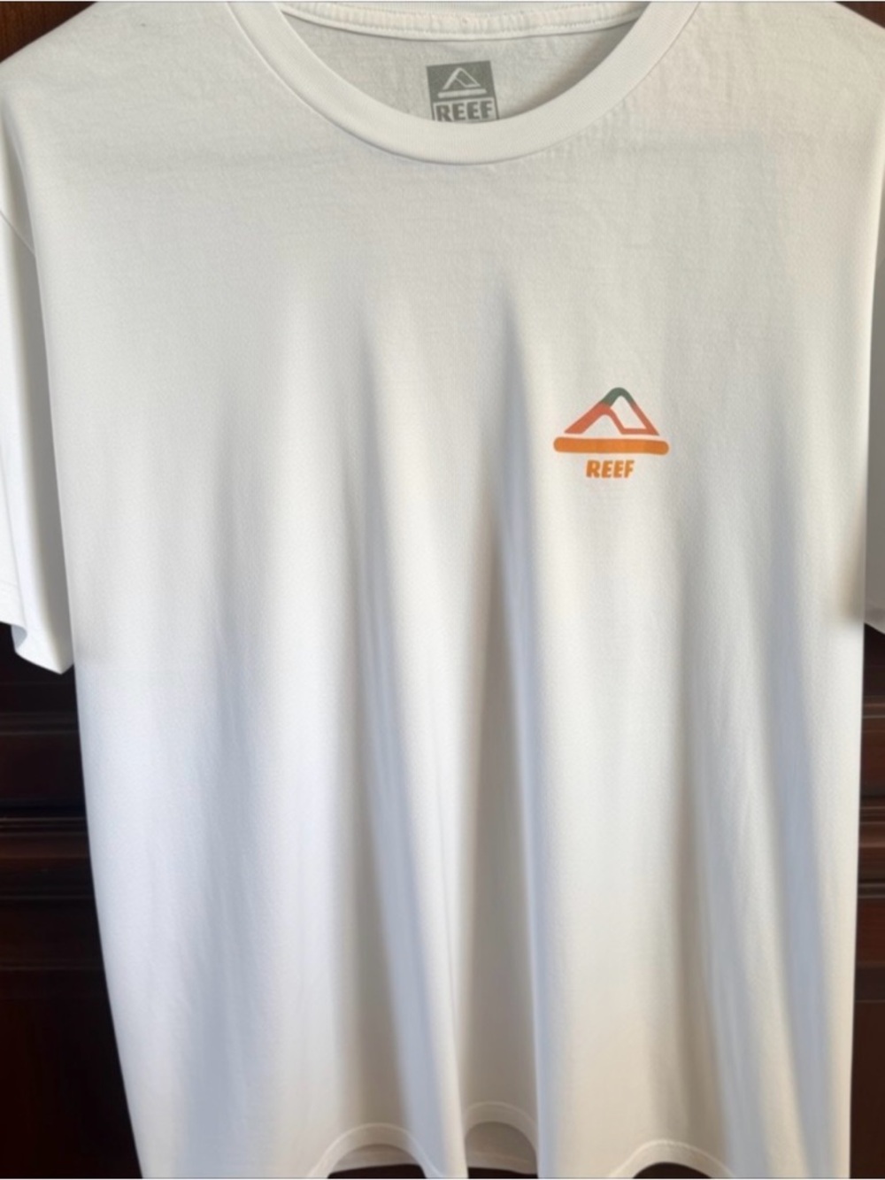 Reef Men’s White Short-Sleeve Logo Tee with Orange & Green Accent